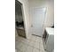 Convenient laundry room with a sink and a door leading outside at 2528 Deerbrook Dr, Lakeland, FL 33811