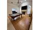 Spacious living room featuring a pool table, fireplace, and natural light from large arched windows at 2528 Deerbrook Dr, Lakeland, FL 33811