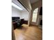 Office space featuring hardwood floors, a desk, fireplace, and natural light from an arched window at 2528 Deerbrook Dr, Lakeland, FL 33811