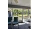 Spacious screened in back porch with plenty of light and seating at 2528 Deerbrook Dr, Lakeland, FL 33811