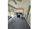 Relaxing screened porch with comfortable seating and ceiling fans at 2528 Deerbrook Dr, Lakeland, FL 33811