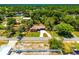 Birds-eye view displays the home nestled among trees in its residential neighborhood at 3646 Palm Rd, Lakeland, FL 33810