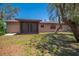 A screened porch overlooks the backyard of the home, offering outdoor relaxation space at 3646 Palm Rd, Lakeland, FL 33810