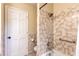 Bathroom features tub, shower, tiled walls, and neutral paint scheme at 3646 Palm Rd, Lakeland, FL 33810