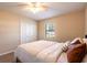 Well-lit bedroom featuring a ceiling fan, closet, and neutral-toned walls at 3646 Palm Rd, Lakeland, FL 33810