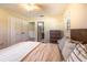 Bedroom featuring natural light, ceiling fan, closet, and view to bathroom at 3646 Palm Rd, Lakeland, FL 33810