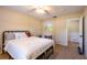Well-lit bedroom featuring a ceiling fan, desk, and natural light at 3646 Palm Rd, Lakeland, FL 33810