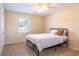 Well-lit bedroom with neutral-toned walls, a ceiling fan, and natural light at 3646 Palm Rd, Lakeland, FL 33810