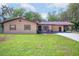 Charming single-story home with manicured lawn and inviting front porch at 3646 Palm Rd, Lakeland, FL 33810