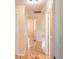 Hallway with decorative wainscoting and light walls at 3646 Palm Rd, Lakeland, FL 33810