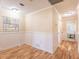 Bright hallway with wood floors leads to an office with natural light at 3646 Palm Rd, Lakeland, FL 33810