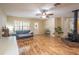 Comfortable living room featuring hardwood floors, natural light, and a cozy fireplace at 3646 Palm Rd, Lakeland, FL 33810