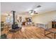Open-concept living area with hardwood floors and a cozy fireplace at 3646 Palm Rd, Lakeland, FL 33810