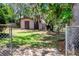 A storage shed is nestled in the backyard at 3646 Palm Rd, Lakeland, FL 33810