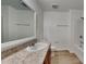 Bathroom featuring wood look flooring, a tub shower combo, and a spacious vanity at 4601 Glencrest Loop, St Cloud, FL 34772