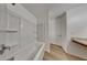 Bright bathroom featuring an all-white tub/shower combo with plenty of room to relax at 4601 Glencrest Loop, St Cloud, FL 34772