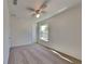 Bedroom featuring a ceiling fan, neutral carpet, and a window for great natural light at 4601 Glencrest Loop, St Cloud, FL 34772
