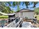 Back yard with a wheelchair ramp leading up to a back deck and hot tub at 528 S Seminole Ave, Fort Meade, FL 33841