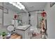 Updated bathroom featuring modern tiling, granite countertops, new fixtures, and vanity with plenty of storage at 528 S Seminole Ave, Fort Meade, FL 33841