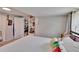 Comfortable bedroom featuring neutral walls, carpeted floor, and ample pillows at 528 S Seminole Ave, Fort Meade, FL 33841