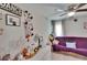 Comfortable bedroom offering ample natural light, ceiling fan, and a serene atmosphere, ideal for relaxation at 528 S Seminole Ave, Fort Meade, FL 33841