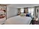 Comfortable bedroom featuring neutral walls, carpeted floor, and ample pillows at 528 S Seminole Ave, Fort Meade, FL 33841
