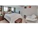 Comfortable bedroom featuring neutral walls, carpeted floor, and ample pillows at 528 S Seminole Ave, Fort Meade, FL 33841