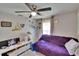Comfortable bedroom features ceiling fan and natural light streaming in from window at 528 S Seminole Ave, Fort Meade, FL 33841