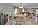 Dining area with hardwood floors, modern lighting, and an open layout, ideal for entertaining guests and Gathering gatherings at 528 S Seminole Ave, Fort Meade, FL 33841