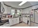 Modern kitchen featuring white cabinets, stainless steel appliances, and granite countertops at 528 S Seminole Ave, Fort Meade, FL 33841