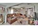 Comfortable living room with hardwood floors, ceiling fan, modern furniture, and ample natural light at 528 S Seminole Ave, Fort Meade, FL 33841