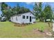 Charming one-story home featuring a well-maintained lawn, simple landscaping, and a cute mailbox at 528 S Seminole Ave, Fort Meade, FL 33841