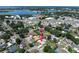 An aerial view of a home, pool, and neighborhood with nearby lake access at 1416 Leighton Ave, Lakeland, FL 33803