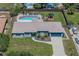 Aerial view of the property showcasing the house, backyard, pool area, and surrounding landscape at 1416 Leighton Ave, Lakeland, FL 33803