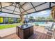 Backyard patio with outdoor seating area and a clear view of the backyard and swimming pool at 1416 Leighton Ave, Lakeland, FL 33803