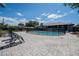 Spacious backyard featuring a fenced in pool, brick patio, and lounge chairs at 1416 Leighton Ave, Lakeland, FL 33803