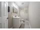 Bathroom with a modern single sink vanity, toilet and decorative wall art at 1416 Leighton Ave, Lakeland, FL 33803
