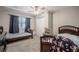Bedroom with two beds, a ceiling fan, and a window with dark curtains at 1416 Leighton Ave, Lakeland, FL 33803