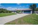 Beautiful home with a long driveway and a well-kept lawn and front garden at 1416 Leighton Ave, Lakeland, FL 33803