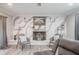 Living room with a cozy fireplace, hardwood floors, and comfortable seating at 1416 Leighton Ave, Lakeland, FL 33803