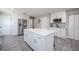 Kitchen featuring a center island, stainless steel appliances, and bright white cabinetry at 1416 Leighton Ave, Lakeland, FL 33803