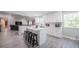 Kitchen with an island featuring white cabinets, stainless steel appliances, and modern countertops at 1416 Leighton Ave, Lakeland, FL 33803