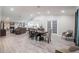Open floor plan featuring a fireplace, living room, dining area, and wood flooring at 1416 Leighton Ave, Lakeland, FL 33803