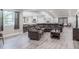 Open-concept living space featuring hardwood flooring and a direct view into the kitchen at 1416 Leighton Ave, Lakeland, FL 33803