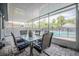 Screened patio with brick flooring, outdoor dining set, and view of fenced in pool at 1416 Leighton Ave, Lakeland, FL 33803