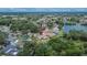 Aerial view showing this home's peaceful, lush neighborhood with multiple ponds and mature trees at 1716 Bayou Cir, Lakeland, FL 33803