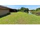 View of the backyard showing proximity to the tranquil waterway, providing a serene outdoor space at 1716 Bayou Cir, Lakeland, FL 33803