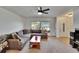 Cozy living room with a large sectional sofa, and natural lighting at 1716 Bayou Cir, Lakeland, FL 33803