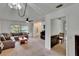 Inviting living room with plush seating, large window, and a ceiling fan at 1716 Bayou Cir, Lakeland, FL 33803