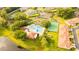 Aerial showcasing the community pool, clubhouse, and tennis court in a well-maintained setting at 2418 Se 23Rd St, Ocala, FL 34471